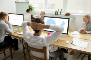 Employee Analyzing Statistics Report Sharing Office Desk